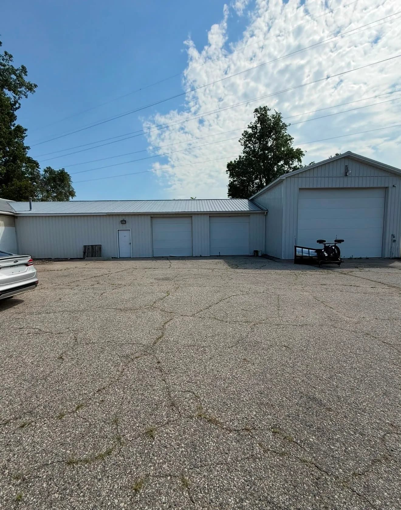 Warehouse 1 at 4025 Holt Rd, with overhead drive-in doors onto a paved apron